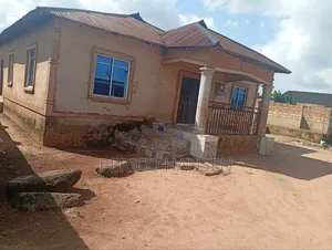 Urgent Fenced Land With Church Building for Sale and 5 Stores