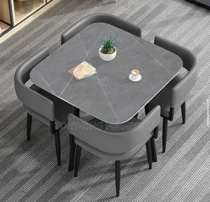 Modern 4-Seater Dining Table Set With Grey Cushioned Chairs.