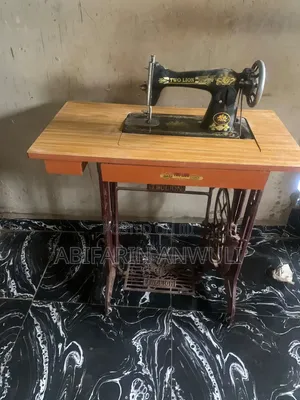 Fairly Used Two Lion Manual Sewing Machine With Stand and Table