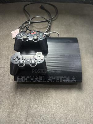 PlayStation3 With Games and Two Controller Power Cord