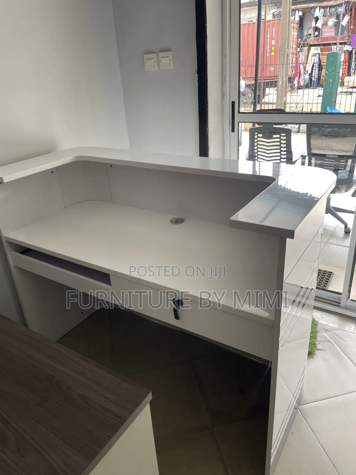 Modern High-Gloss White Reception Desk With Silver Stripe Accent