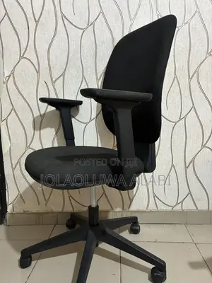 Ergonomic Chairs and Roller Window Blind