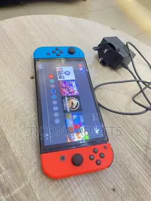 Nintendo Switch Oled With Games and Charger
