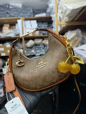 Midi Coach Joine Clutch Bag With a Branded Box