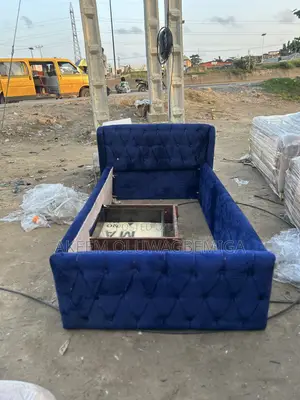 3by6 Button Tufted Blue Bedframe With Drawer by the Side