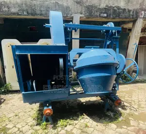 Industrial Machinery Concrete Mixer With Hoist and Pulley System.