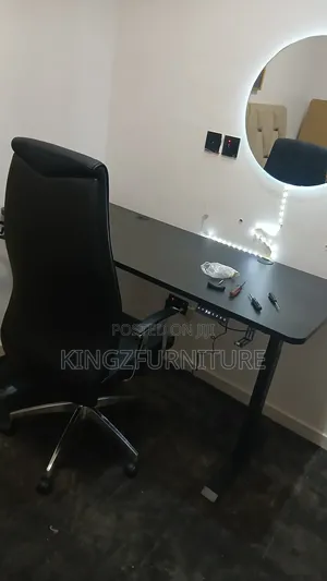 Office Chair Paired With a Electric Height-Adjustable Standing Desk.