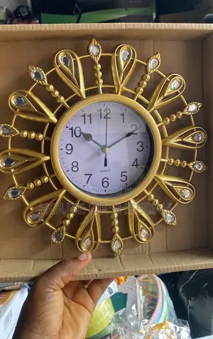 A Decorative Gold Sunburst Clock