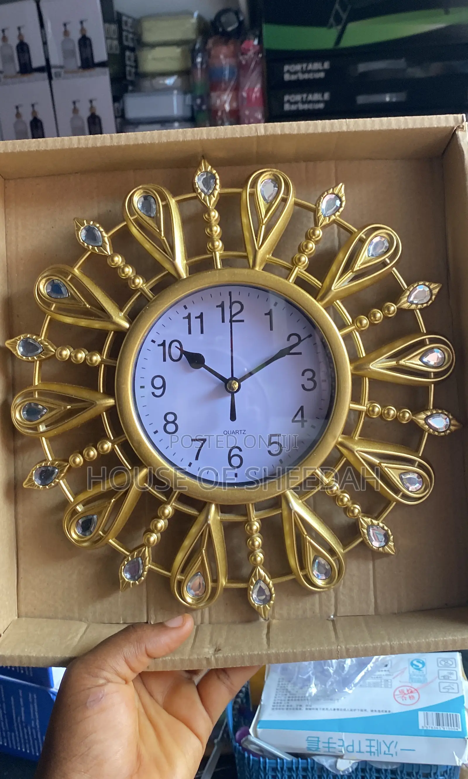 A Decorative Gold Sunburst Clock