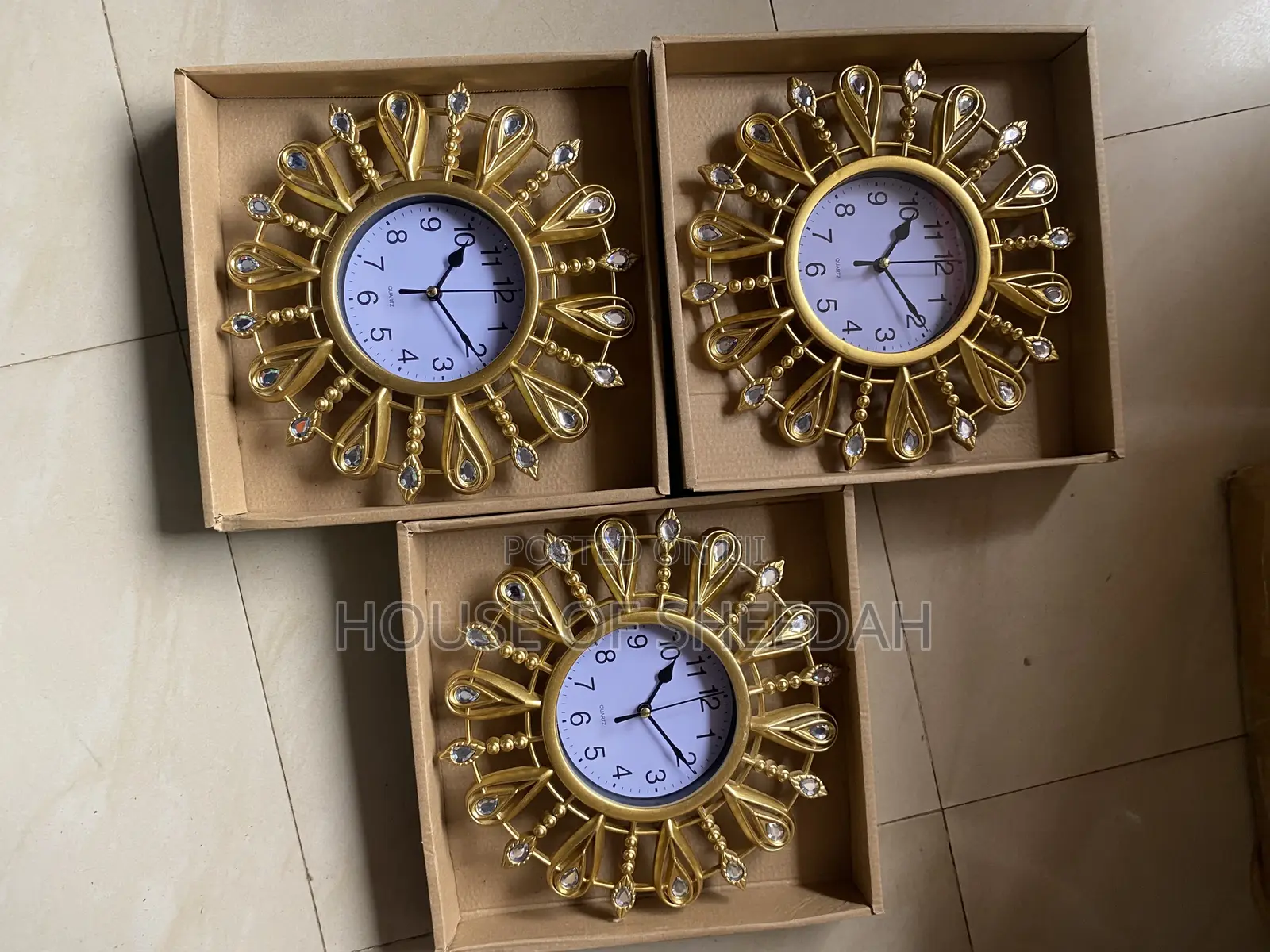 A Decorative Gold Sunburst Clock