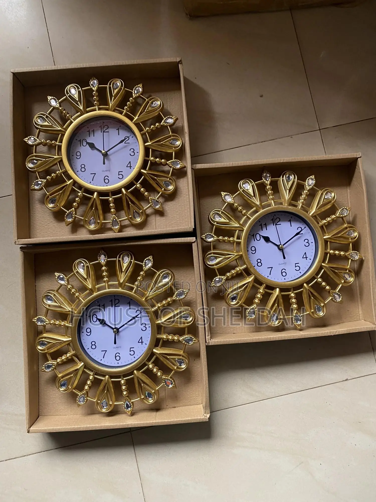 A Decorative Gold Sunburst Clock