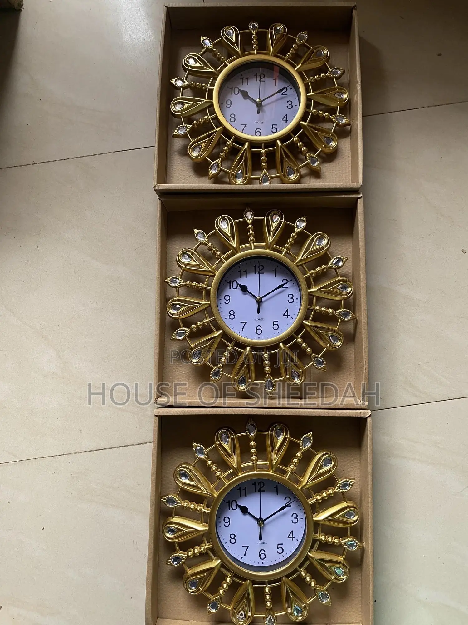 A Decorative Gold Sunburst Clock