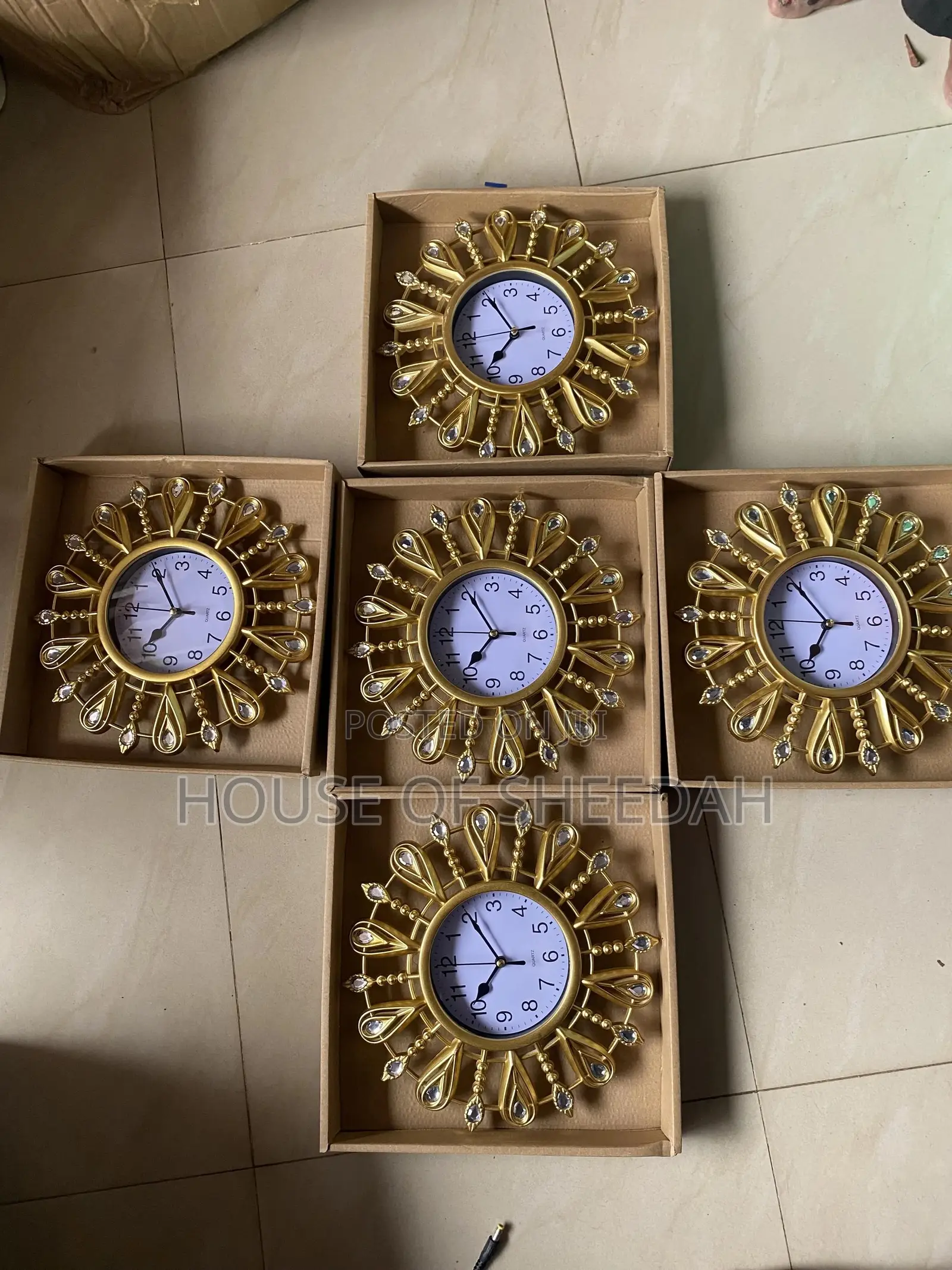 A Decorative Gold Sunburst Clock
