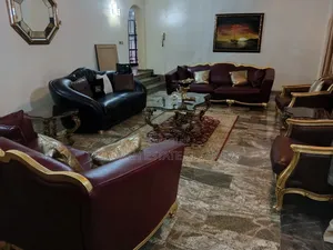 Seven Seater Leather Chair ,Centre Rug and Table With Two Side Stool
