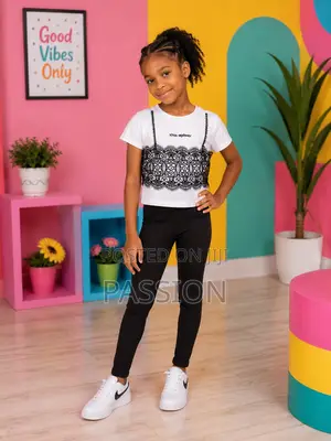 Fashionable Girls’ White Lace Top and Black Trousers