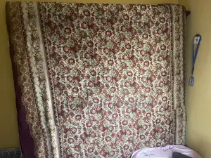 A Bed and Set of Chairs for Sale.