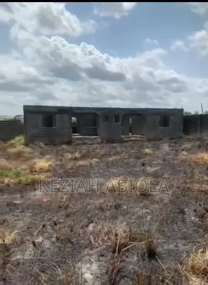 A Plot of Land With Two 2-Bedroom Flat Structures on It.