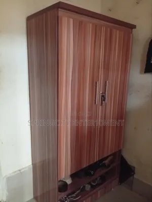 Neatly Used 2-Door Wooden Wardrobe With Shoe Rack – ₦95,000