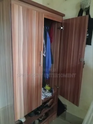 Neatly Used 2-Door Wooden Wardrobe With Shoe Rack – ₦85,000
