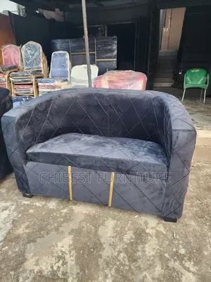 Grey Double Seater Padded Sofa Chair.