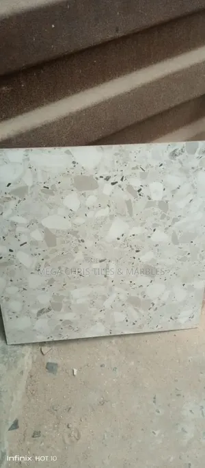 60x60 Carara Gold , Spanish.