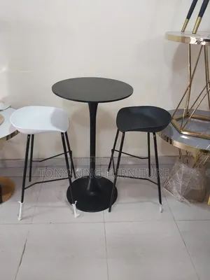 Imported Fiber Stools and a Black Tabletop With a Metallic-Style Base.