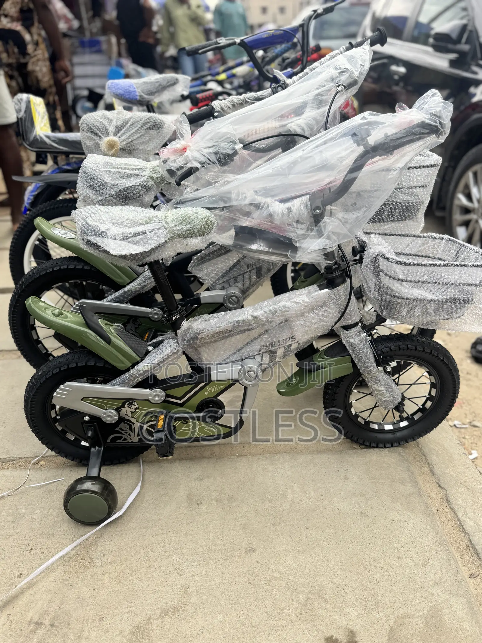 Children's Bicycle Features Training Wheels and a Small Front Basket.