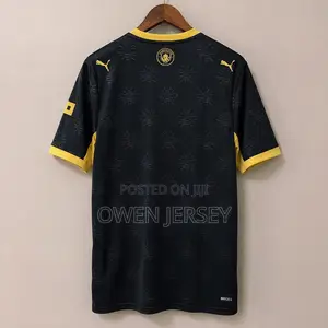 Manchester City Black Gold Football Jersey – Premium Away Style.