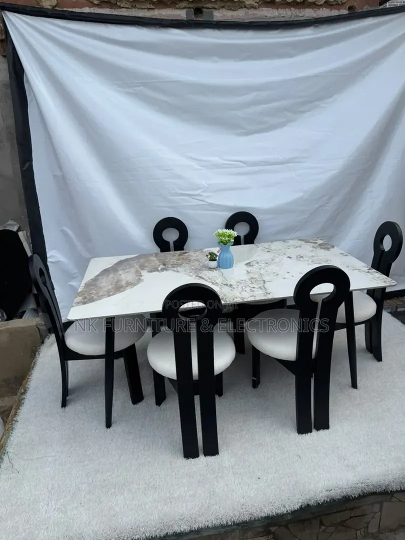 Classy Marble Top Dining  Set by Six Chairs