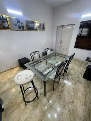 Neatly Used Glass Dining Set With Side Stool