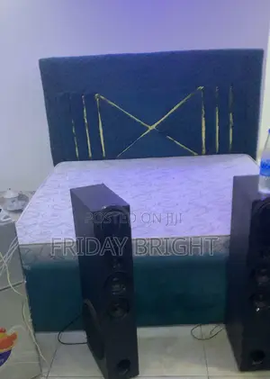 Bed With Frame and Chairs With Other Items