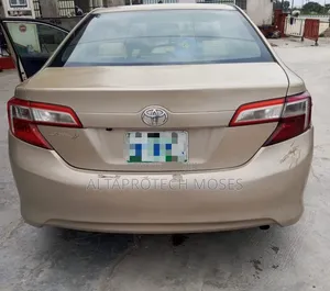 Toyota Camry L 4dr Sedan (2.5L 4cyl 6A) 2013 Gold