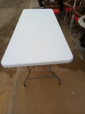 A Uniquely Designed 6 Feet Plastic Top and Metal Legs Table