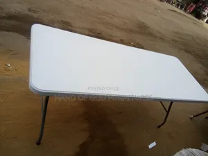 A Uniquely Designed 6 Feet Plastic Top and Metal Legs Table