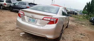 Toyota Camry LE 4dr Sedan (2.5L 4cyl 6A) 2014 Gold