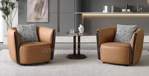 Two Rotating Accent Leather Chairs
