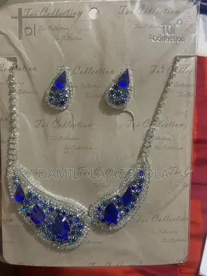Blue Stone Pendant Necklace With Silver Chain and Earrings