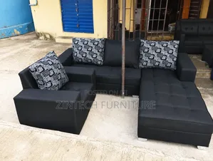 Black L Couch and a Single Seater