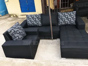 Black L Couch and a Single Seater