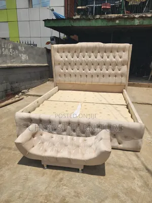 Neatly Padded 6by6 Cream Coloured Bed With Leg Rest.