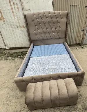 4.5 by 6 Upholstery Quality Bedframe With an Ottoman 