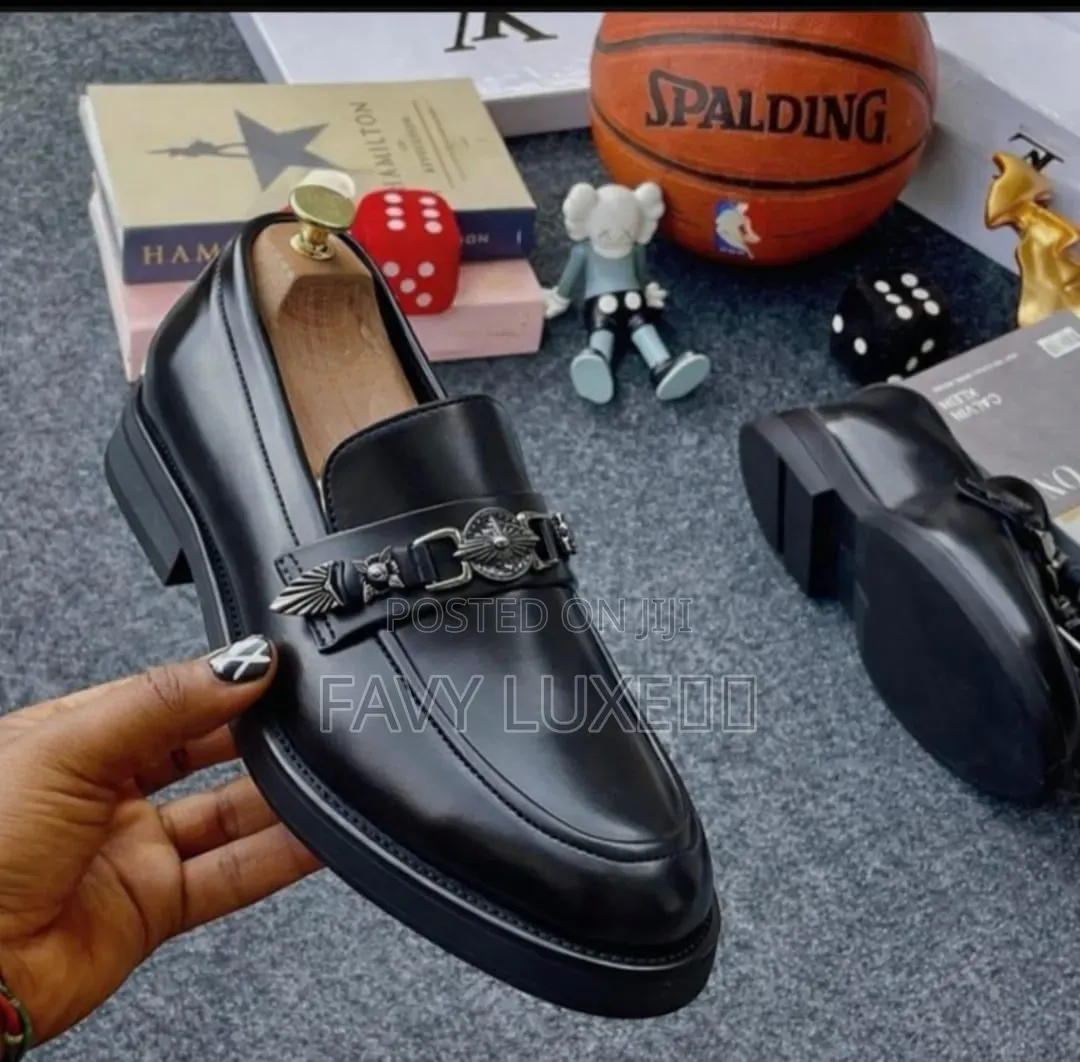 Prada Noir Regal Chain-Emblem Loafer.