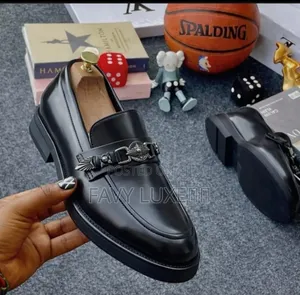 Prada Noir Regal Chain-Emblem Loafer.