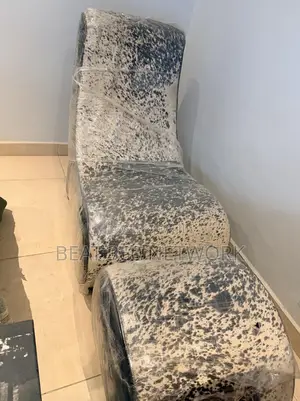 Animal Skin Othman Chair and Leg Rest With Matching Black White Rug