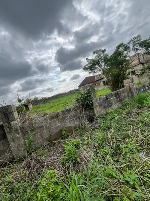 A Plot and Half Fenced Land in Alagbaka Gra for Sale-