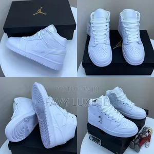 Air Jordan 1 Mid Triple White High-Top Sneakers.