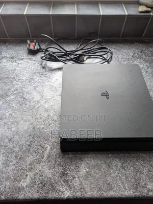 Playstation 4 Slim With 2 Controllers and Physical Game Discs