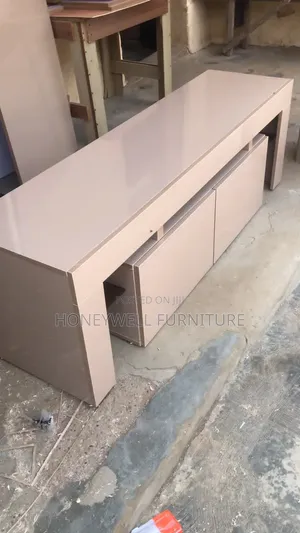 Glossy TV Console With Doors and Glass Shelves on Both Sides