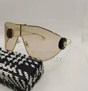 Versace Gold-Tone Shield Sunglasses.