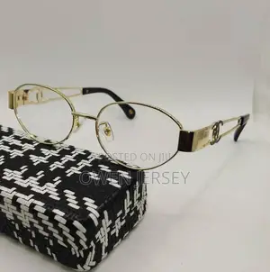 Gold-Tone Oval Eyeglasses With Black Temple Details.